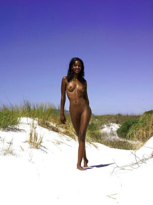 Petite dark-hued virgin posing in the sand,amateur mulatto