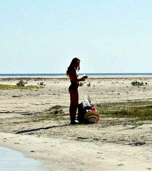 Slim and tall virgin model Katya posing on beach entirely
