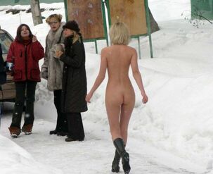 Luscious blonde posing naked outdoor in the public place,