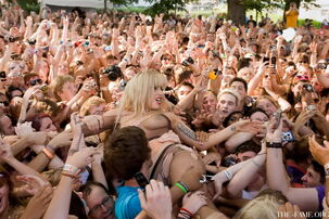 Nymph Gaga crowd surfing at Lollapalooza wearing just