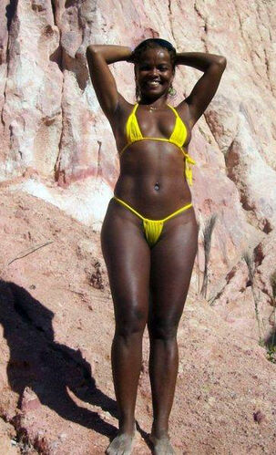 Afro lady on a beach. she's a uber-sexy and very..