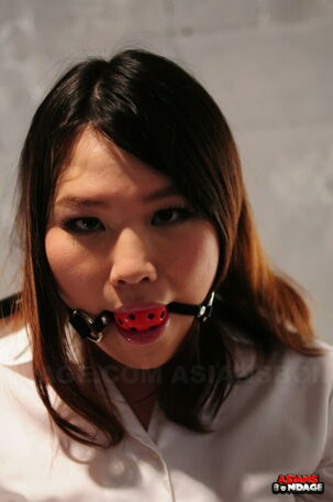 Japanese nymph Aki Sasahara is fitted with gag in milky