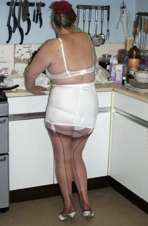 Gross mature housewife in brief milky garb at home