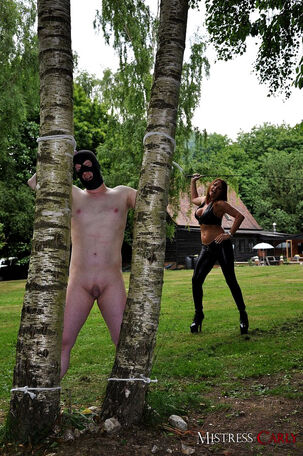 Damsel dom Dominatrix Carly ties hubby up in the yard to