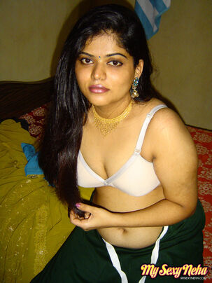 Round Indian woman Neha Nair lets her bra-stuffers splash